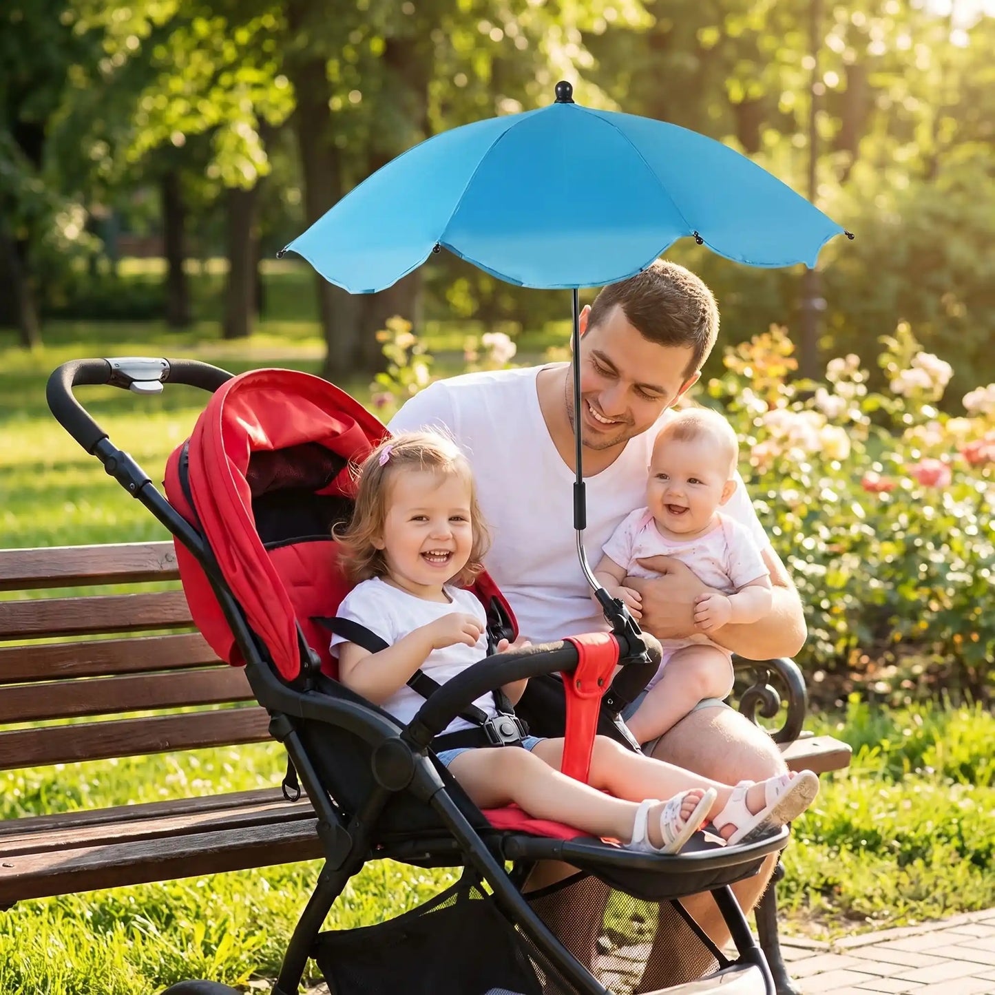Ombrelle poussette papa avec ses bebes au parc