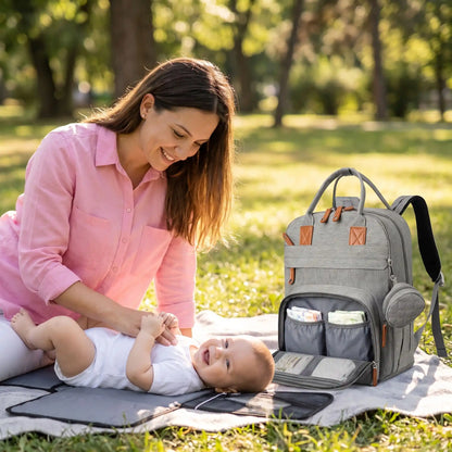 Sac à langer à dos maman au parc