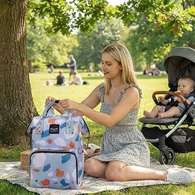 sac à langer bébé maman fait pique nique en famille